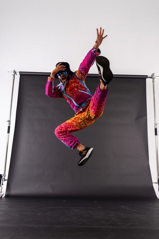 Dancer mid-air on black paper roll